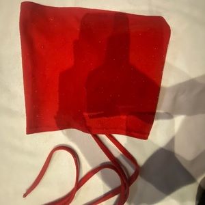 red with glitter xs tube top opened from the back with adjustable strings.